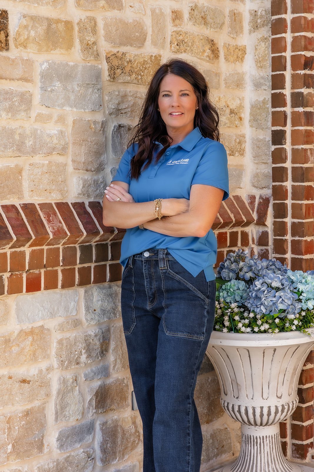 woman standing by stone wall