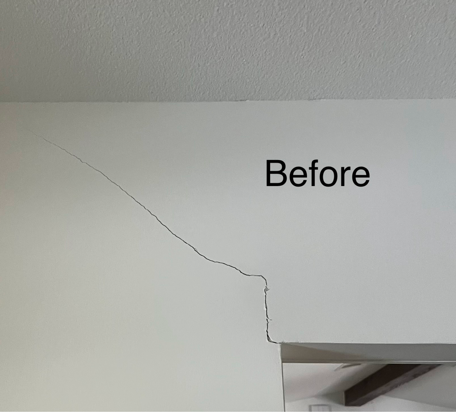 Crack above a doorway, before